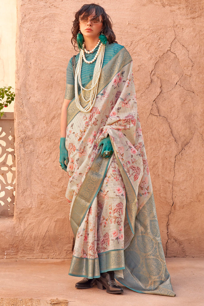 Beige and Turquoise Zari Woven Printed Georgette saree