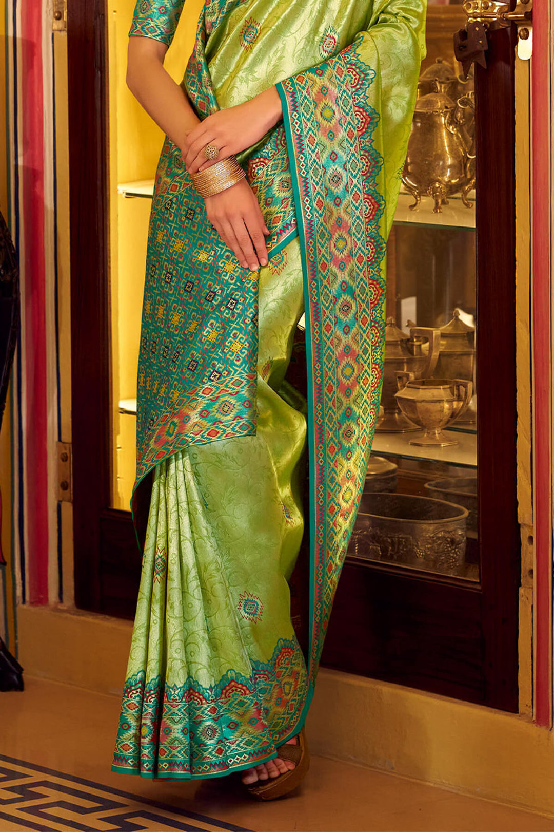 Trendy Green Patola Tissue Silk Saree
