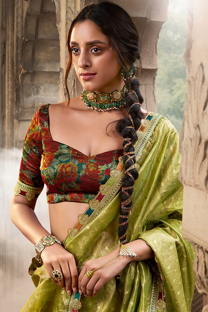 Trendy Green Pure Tissue Silk Saree with Multicolor Lace Border