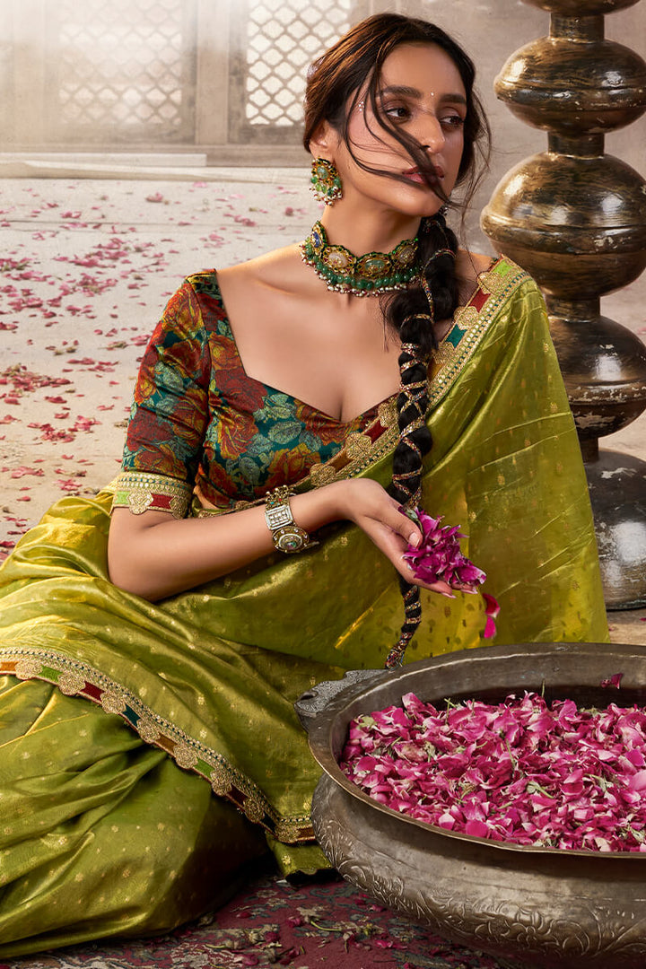Trendy Green Pure Tissue Silk Saree with Multicolor Lace Border