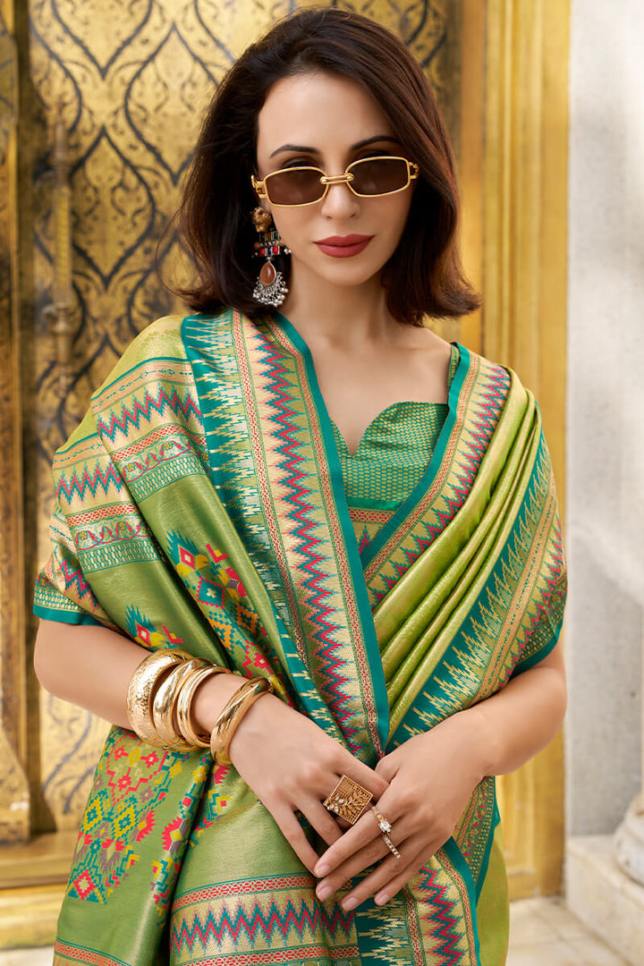 Trendy Green Zari Woven Tissue Silk Saree